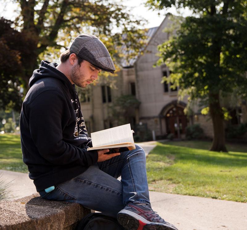 Students reading a textbook